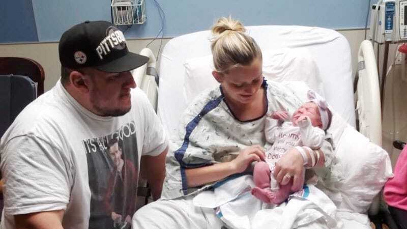 hospital room couple and baby